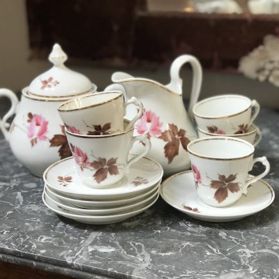 Vintage coffee set with leaves and flowers