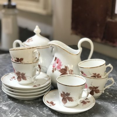 Vintage coffee set with leaves and flowers