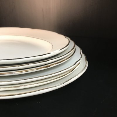 Vintage set of oval serving platters with gold edges