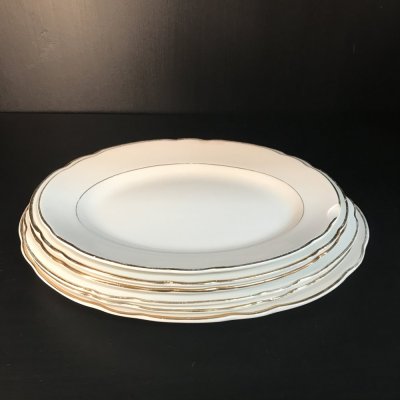 Vintage set of oval serving platters with gold edges