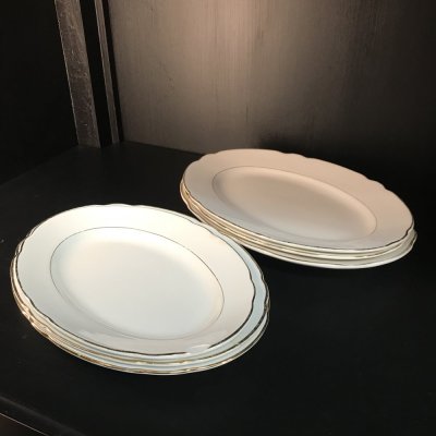 Vintage set of oval serving platters with gold edges