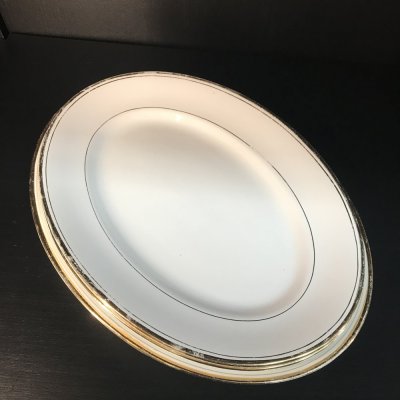 Vintage set of oval serving platters with gold edges