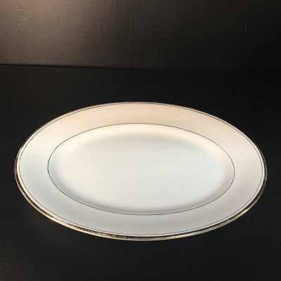 Vintage set of oval serving platters with gold edges