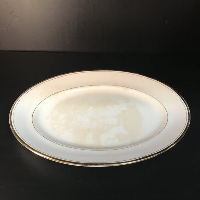 Vintage set of oval serving platters with gold edges