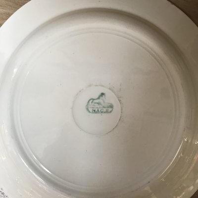 Round vintage platter with red lines and green design