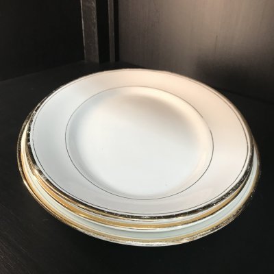 Vintage set of oval serving platters with gold edges