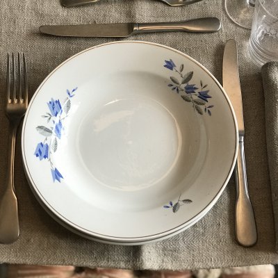 Vintage table set with blue flowers