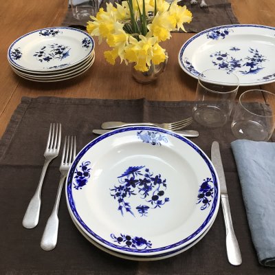Vintage table set with blu flower decoration