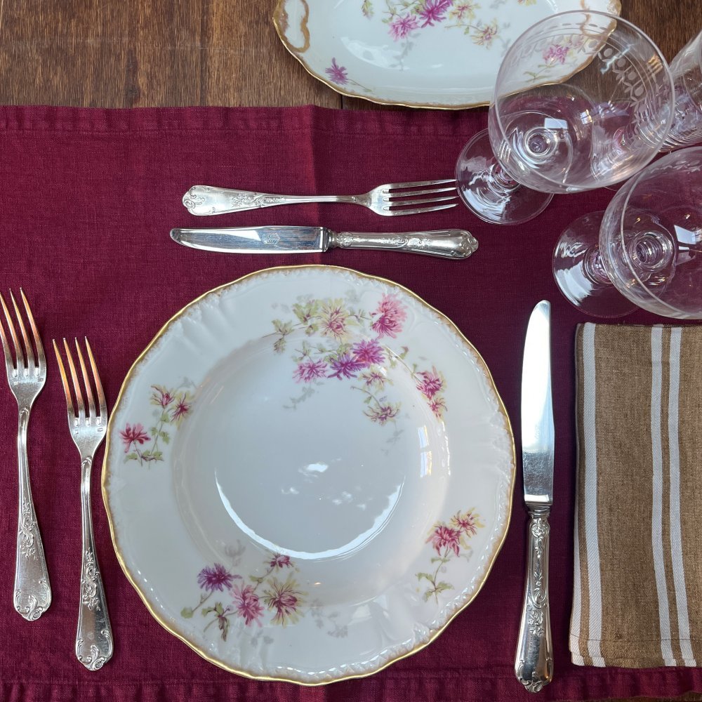 Vintage table set with pink flowers and gold edge