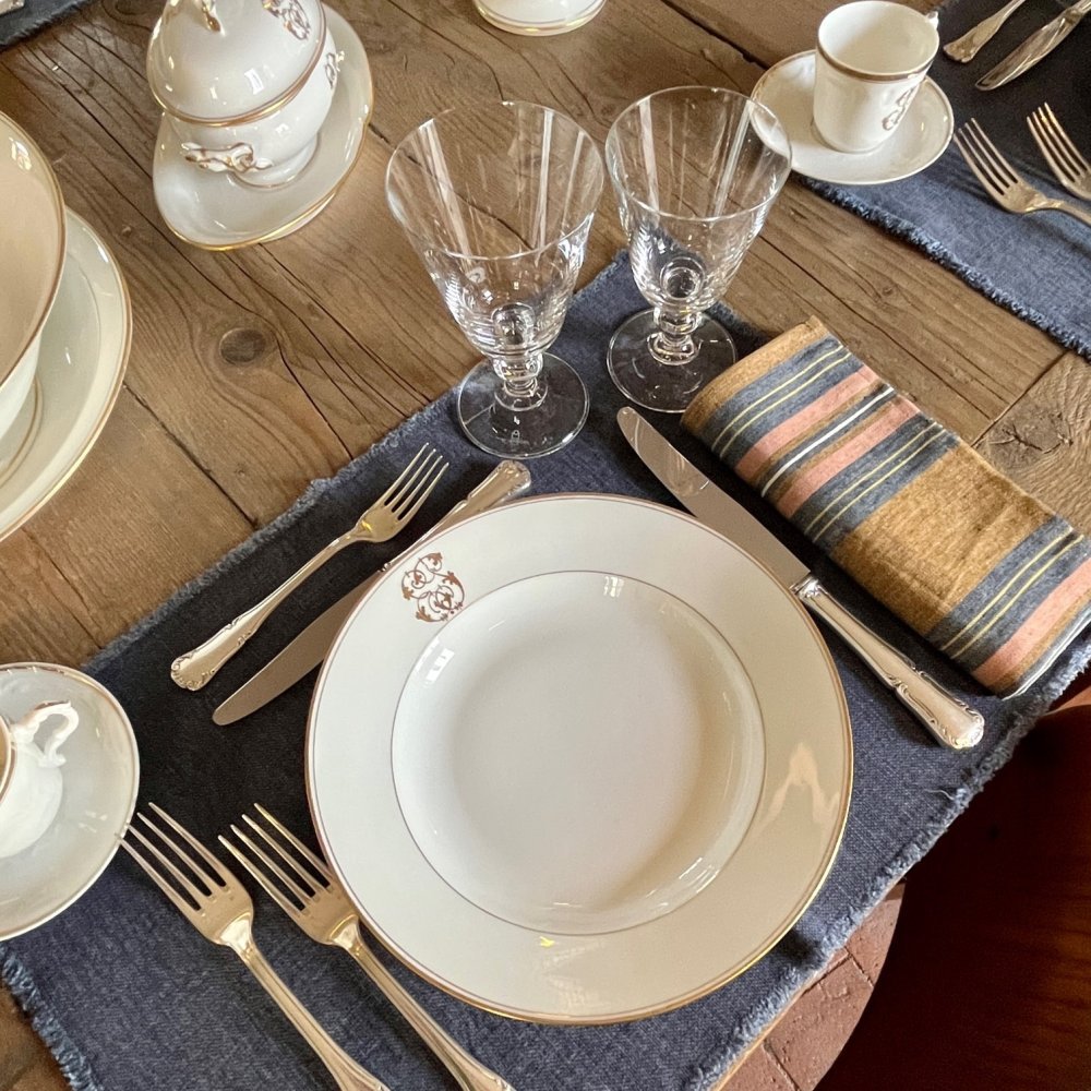Vintage table set with gold lines and monogram