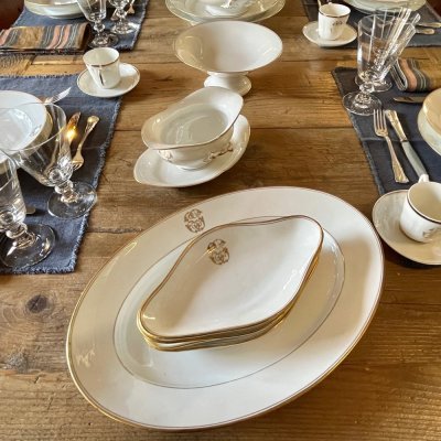 Vintage table set with gold lines and monogram 