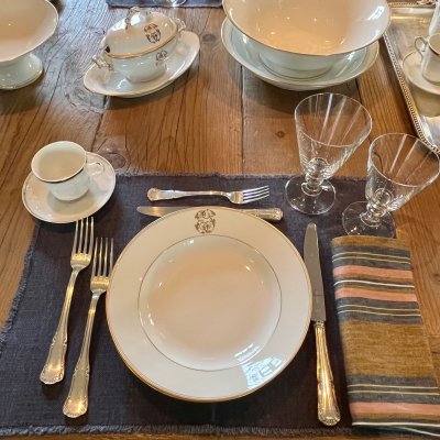 Vintage table set with gold lines and monogram 