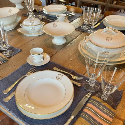 Vintage table set with gold lines and monogram 