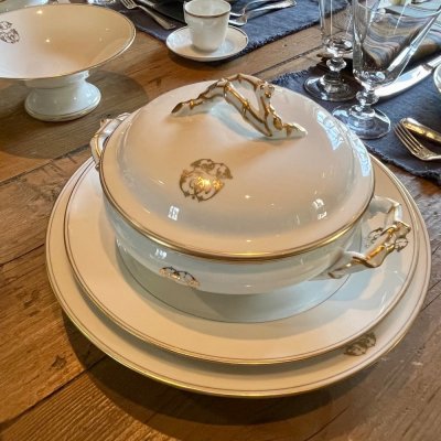Vintage table set with gold lines and monogram 