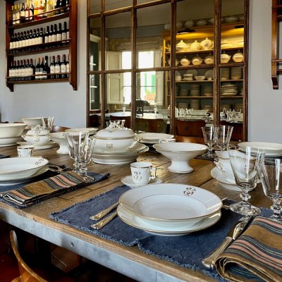 Vintage table set with gold lines and monogram 