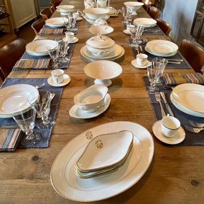 Vintage table set with gold lines and monogram 